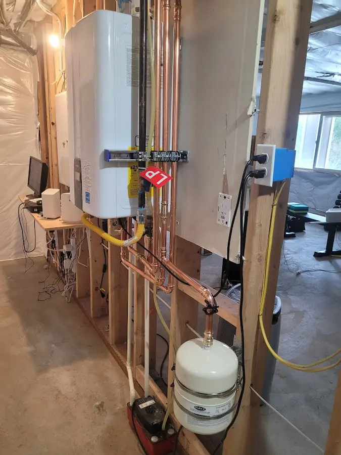 Licensed plumber repairing a kitchen sink in Brookfield